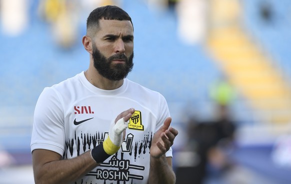 Al Ittihad&#039;s Karim Benzema greets fans during his team match against Al Raed in the Saudi Professional League, in Buraidah, Saudi Arabia, Monday, Aug. 14, 2023. (AP Photo)