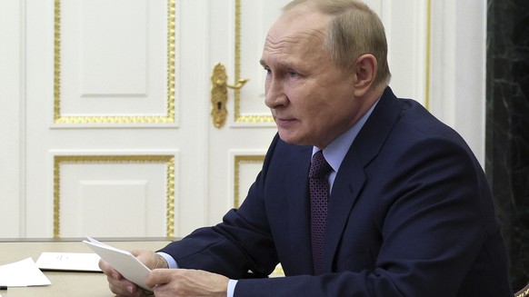 Russian President Vladimir Putin chairs a meeting on economic issues via teleconference call in Moscow, Russia, Monday, Sept. 12, 2022. (Gavriil Grigorov, Sputnik, Kremlin Pool Photo via AP)