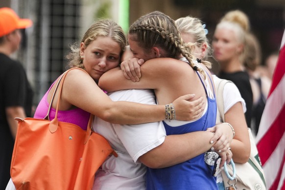 Campers embrace after arriving to a reunification area as girls from Camp Waldemar, near the North fork of the Guadalupe River, are reconnected with their families after heavy rainfall in Central Texa ...