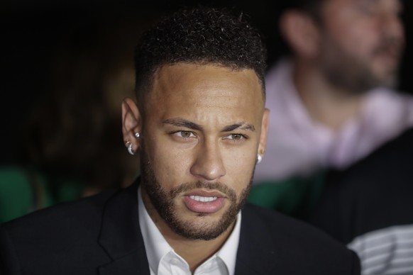 Brazil's soccer player Neymar speaks to the press as he leaves a police station where he answered questions about rape allegations against him in Sao Paulo, Brazil, Thursday, June 13, 2019. Neymar den ...