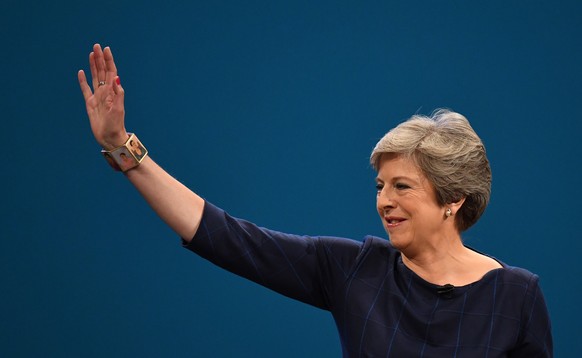 epa07467341 (FILE) - Britain&#039;s Prime Minister Theresa May waves to delegates as she delivers her speech on the final day of Conservative Party Conference in Manchester, Britain, 04 October 2017 ( ...