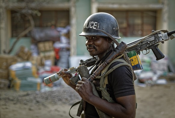 FILE- A Nigerian policeman provides security at the offices of the Independent National Electoral Commission in Kano, northern Nigeria Thursday, Feb. 14, 2019. Nigeria&#039;s police on Friday, June 3, ...