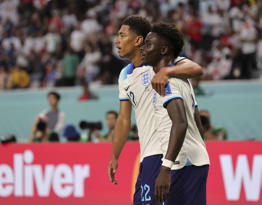 England v Iran 2022 FIFA World Cup, WM, Weltmeisterschaft, Fussball Bukayo Saka celebrates with Jude Bellingham after scoring Englands second goal during the 2022 FIFA World Cup Group B match at Khali ...