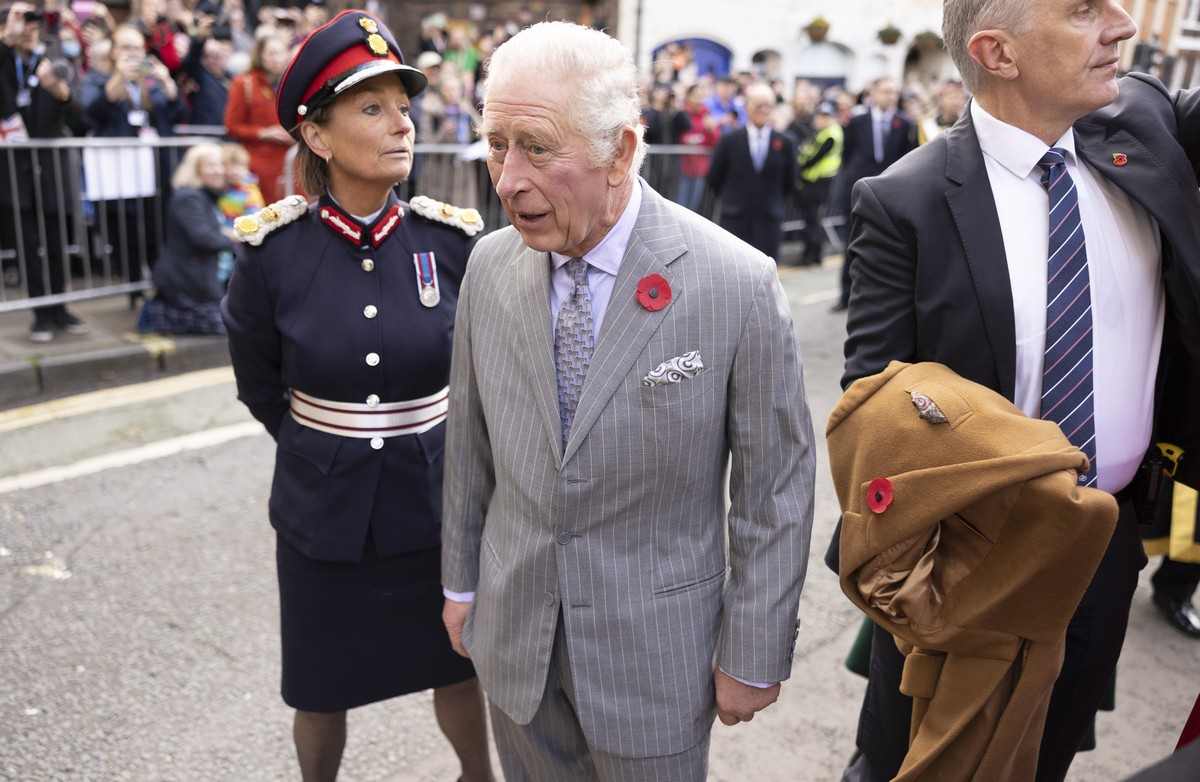 Britain's King Charles III reacts after an egg, bottom left, was thrown his direction as he arrived for a ceremony at Micklegate Bar, where the Sovereign is traditionally welcomed to the city, in ...