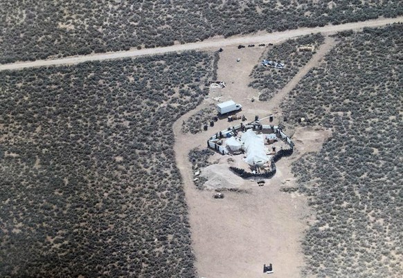 epa06929785 A handout photo made available by Taos County Sheriff’s Office shows an aerial photo of compound in rural Amalia, New Mexico, USA (issued 05 August 2018). Law enforcement officers found 11 ...