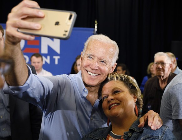 Democratic presidential candidate former Vice President Joe Biden poses for a photo with an audience member after speaking at Clinton Community College, Wednesday, June 12, 2019, in Clinton, Iowa. (AP ...