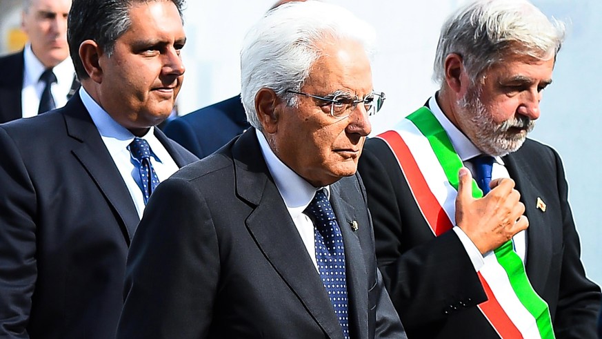 epa07772570 Liguria Region Governor Giovanni Toti (L), Italian President Sergio Mattarella (C) and Genoa Mayor Marco Bucci (R) attend the memorial ceremony for the victims on the first anniversary of  ...