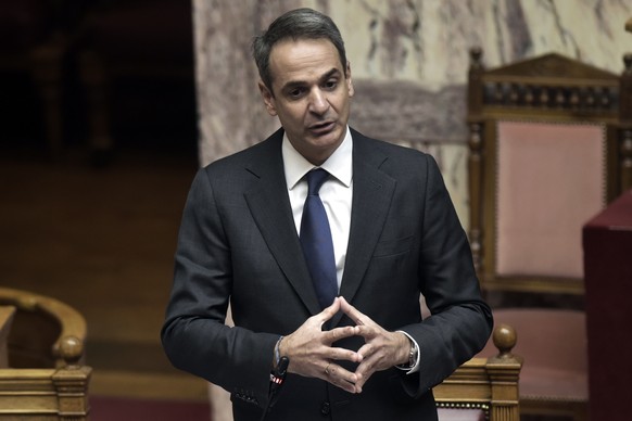 Greece&#039;s Prime Minister Kyriakos Mitsotakis speaks during a Parliament debate in Athens, Wednesday, Jan. 20, 2021. Lawmakers in Greece are set to approve legislation to extend the country&#039;s  ...