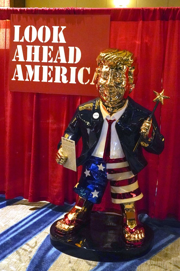 A statue of former president Donald Trump on display at the merchandise show at the Conservative Political Action Conference (CPAC) Friday, Feb. 26, 2021, in Orlando, Fla. (AP Photo/John Raoux)