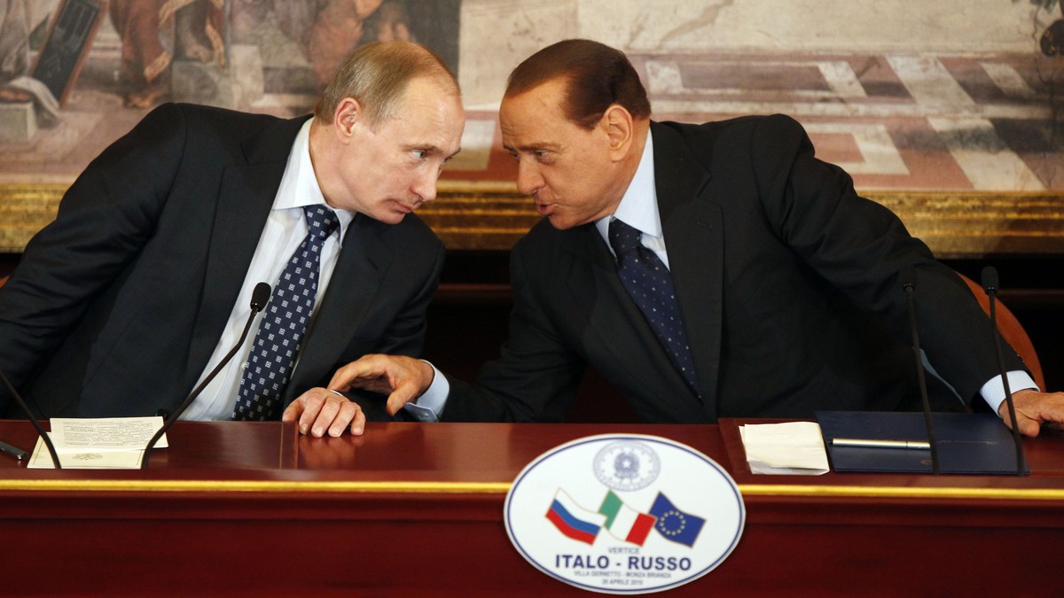FILE - Italian former Premier Silvio Berlusconi, right, and Russian Prime Minister Vladimir Putin talk during a press conference at Villa Gernetto, in Gerno, near Milan, Italy, Monday April 26, 2010.  ...