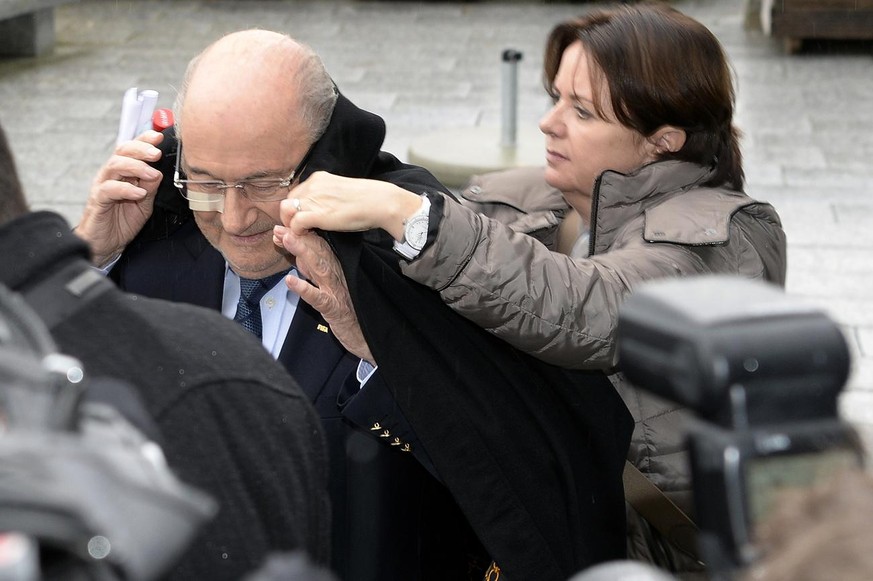 Joseph S. &quot;Sepp&quot; Blatter, left, suspended FIFA president and his daughter Corinne, right, leave the FIFA&#039;s headquarters Hotel Sonnenberg in Zurich, Switzerland, Monday, December 21, 201 ...