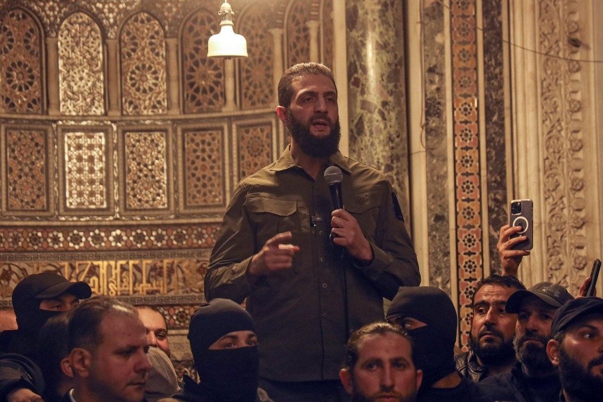 Abu Mohammed al-Golani speaks at the Umayyad Mosque in Damascus Sunday Dec. 8, 2024. Golani, a former al-Qaida commander who cut ties with the group and says he embraces pluralism and religious tolera ...