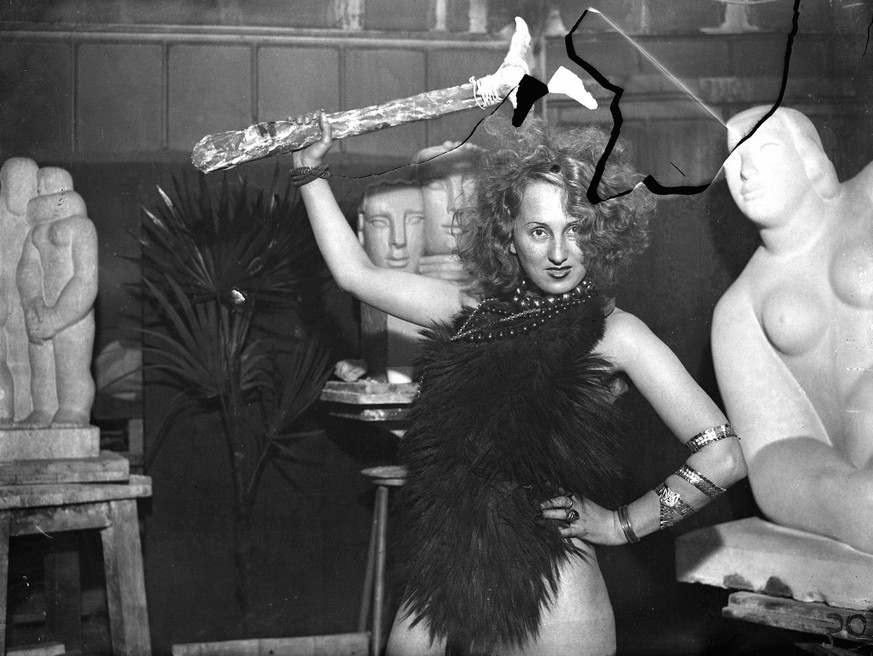 The cave girl . Students are preparing for the Chelsea Arts Ball , the theme of which is Looking backwards to be held at the Royal Albert Hall on New Year s Eve . Photo shows , a stone age girl rehear ...