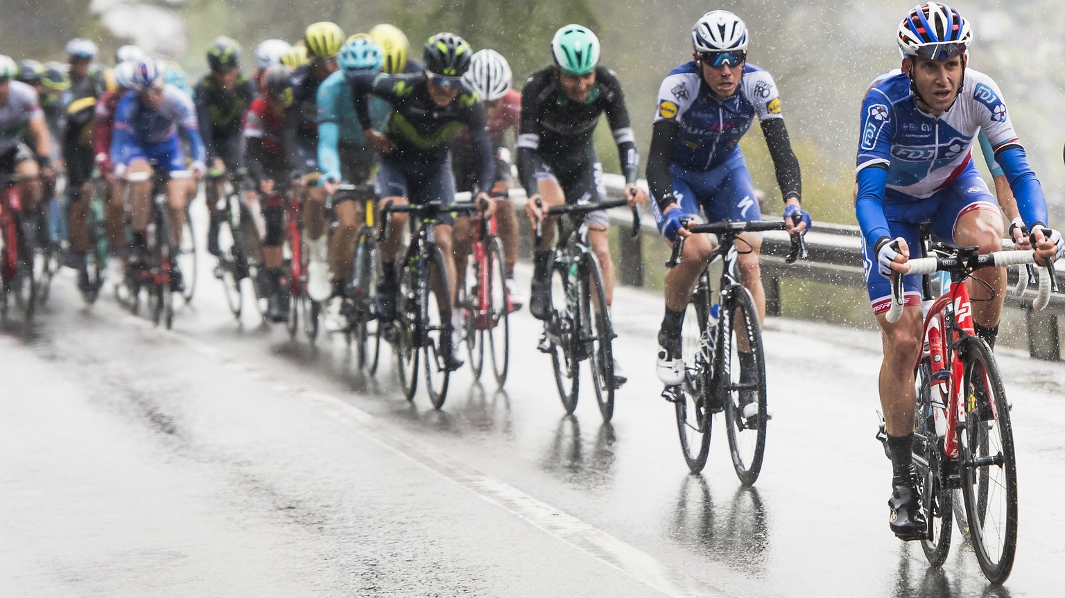 Sebastien Reichenbach from Switzerland of team FDJ, 4th from right, in action with the pack rides during the first stage, a 173.3 km race between Aigle and Champery at the 71th Tour de Romandie UCI Pr ...