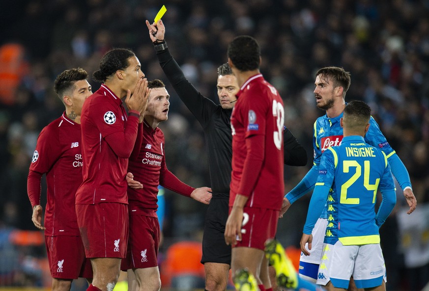 epa07224448 Liverpool's Virgil van Dijk (2-L) receives a yellow card during the UEFA Champions League Group C soccer match between Liverpool FC and SSC Napoli held at the Anfield in Liverpool, Britain ...