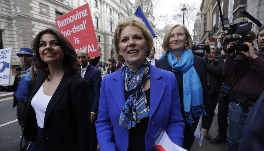 CAPTION CORRECTS NAME SPELLING - British politicians Heidi Allen, left, Anna Soubry, centre, and Sarah Wollaston, right, arrive for a press conference in Westminster in London, Wednesday, Feb. 20, 201 ...