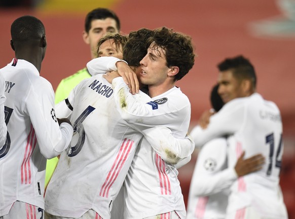 epa09135923 Real Madrid players celebrate after the UEFA Champions League quarter final, second leg soccer match between Liverpool FC and Real Madrid in Liverpool, Britain, 14 April 2021. EPA/Peter Po ...