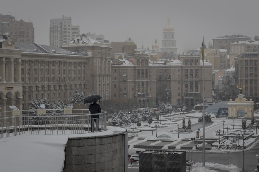 A man looks at the Independent Square (Maidan) in Kyiv, Ukraine, Monday, Nov. 21, 2022. People gathered to commemorate the Maidan protest movement and the events which took place in late Feb. 2014 tha ...