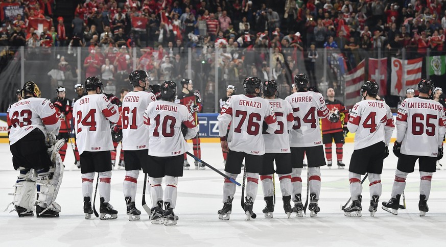 epa05962362 Switzerland&#039;s players react after winning the IIHF Ice Hockey World Championship 2017 group B preliminary round game between Canada and Switzerland, in Paris, France, 13 May 2017. EPA ...