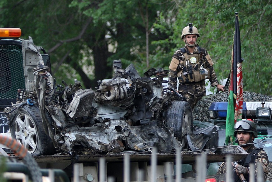 epa05941390 An Afghan security official inspects the site of a suicide bomb blast that targeted an NATO convoy near a National Directorate of Security (NDS) checkpoint, in Kabul, Afghanistan, 03 May 2 ...