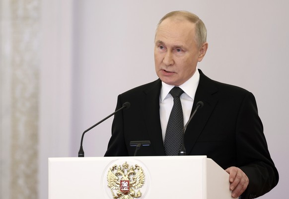 epa11017431 Russian President Vladimir Putin delivers a speech during a ceremony to present Gold Star medals to Heroes of Russia on the eve of Heroes of the Fatherland Day at the St. George Hall of th ...