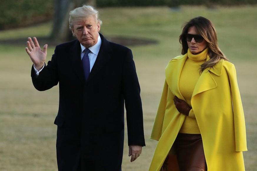 epa06499024 US President Donald J. Trump (L) and First Lady Melania Trump return to the White House via Marine One, in Washington, DC, USA, 05 February 2018. The President and First Lady spent the day ...