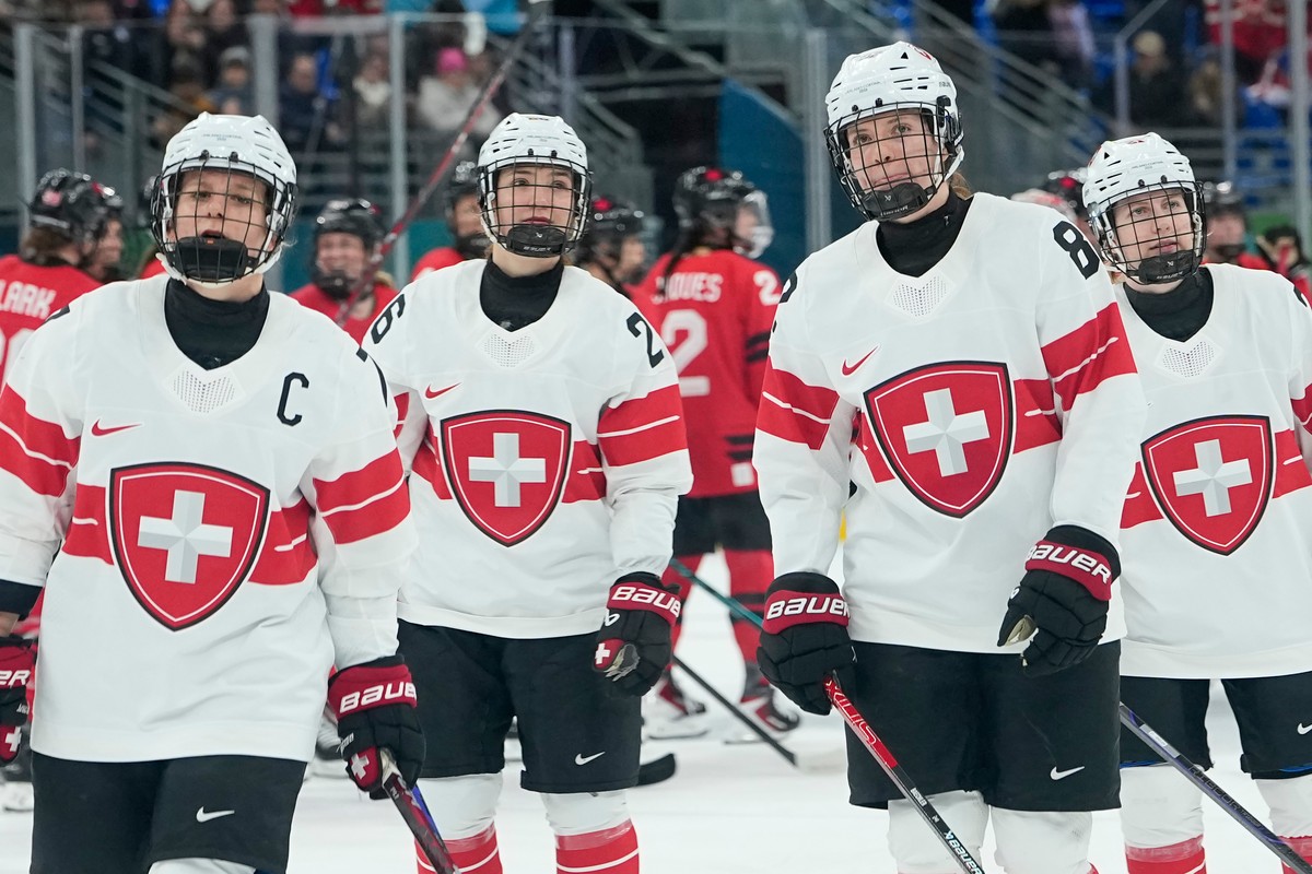 Switzerland's players are dejected afte during a semifinal match of women's ice hockey between the Canada and Switzerland at the 2026 Winter Olympics, in Milan, Italy, Monday, Feb. 16, 2026. ...