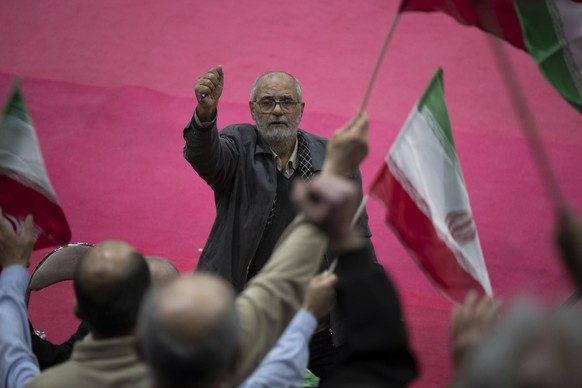 Iran-Daily Life And The Elections Campaigns In Tehran Hossein Allahkaram, an Iranian conservative hardliner activist, is shouting anti-Israel and anti-U.S. slogans during an electoral campaign for Ira ...