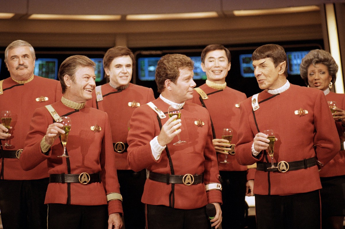 FILE - Members of the "Star Trek" crew, from left, James Doohan, DeForest Kelley, Walter Koenig, William Shatner, George Takei, Leonard Nimoy and Nichelle Nichols, toast the newest "Sta ...