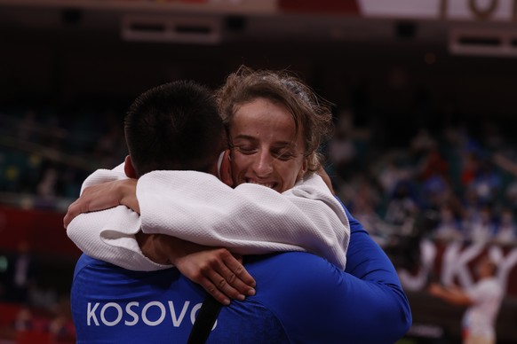 epa09361430 Distria Krasniqi (White) of Kosovo celebrates after defeating Munkhbat Urantsetseg of Mongolia during their bout in the Women -48 kg Semi-final of table A at the Judo competitions of the T ...