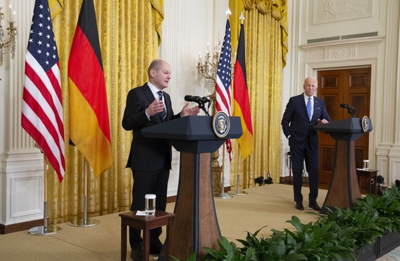 epa09736576 Chancellor of Germany Olaf Scholz (L) and US President Joe Biden (R) hold a joint news conference in the East Room of the White House in Washington, DC, USA, 07 February 2022. Biden hosts  ...