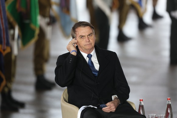 epa07475382 Brazilian President Jair Bolsonaro attends a welcoming ceremony at Ben Gurion International Airport near Tel Aviv, Israel, 31 March 2019. Jair Bolsonaro arrived for a four-day official vis ...