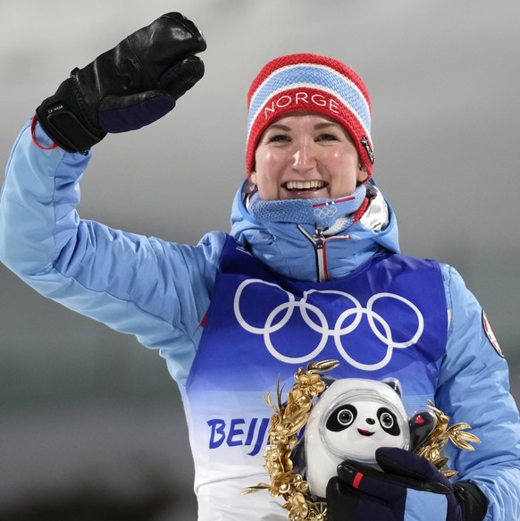 Marte Olsbu Roeiseland of Norway celebrates during a venue ceremony after the women&#039;s 7.5-kilometer sprint competition at the 2022 Winter Olympics, Friday, Feb. 11, 2022, in Zhangjiakou, China. ( ...