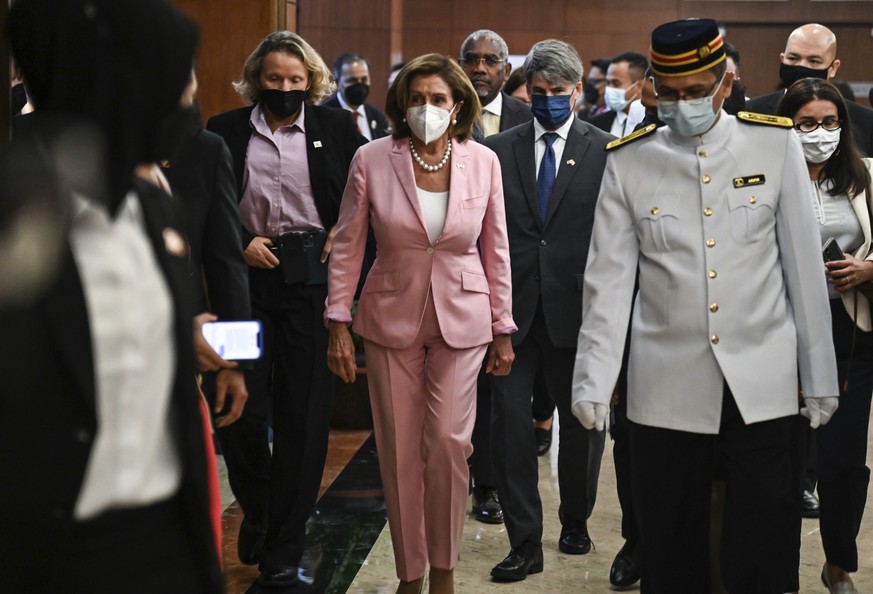 This handout photo taken and released by Malaysia���s Department of Information, U.S. House Speaker Nancy Pelosi, center, tours the parliament house in Kuala Lumpur, Tuesday, Aug. 2, 2022. Pelosi arri ...