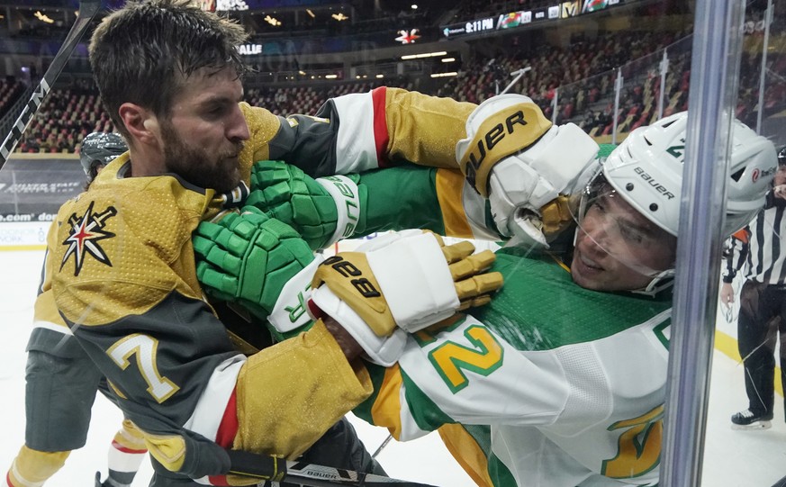 Vegas Golden Knights defenseman Alex Pietrangelo (7) and Minnesota Wild left wing Kevin Fiala (22) fight during the third period of an NHL hockey game Wednesday, March 3, 2021, in Las Vegas. (AP Photo ...
