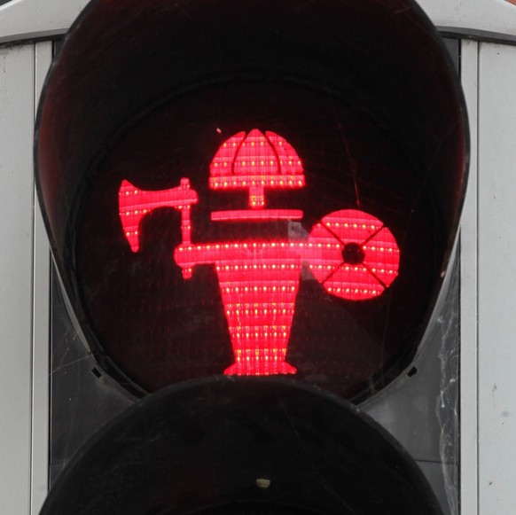 Aarhus, Denmark - August 6, 2020: Pedestrian red traffic light with a viking in Aarhus, Denmark