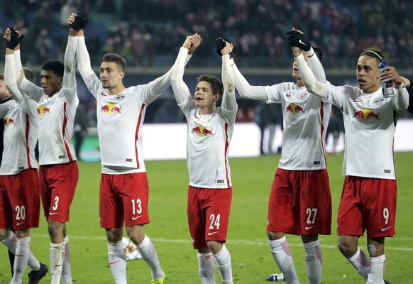 Leipzig&#039;s players celebrate after the German Bundesliga soccer match between RB Leipzig and Hertha BSC Berlin in Leipzig, Germany, Saturday, Dec. 17, 2016. Leipzig defeated Berlin by 2-0. (AP Pho ...