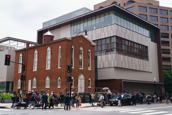 epa12126232 Members of the media at the scene where two people were shot and killed near the Capital Jewish Museum in Washington, DC, USA, 22 May 2025. According to a social media post by the US Homel ...