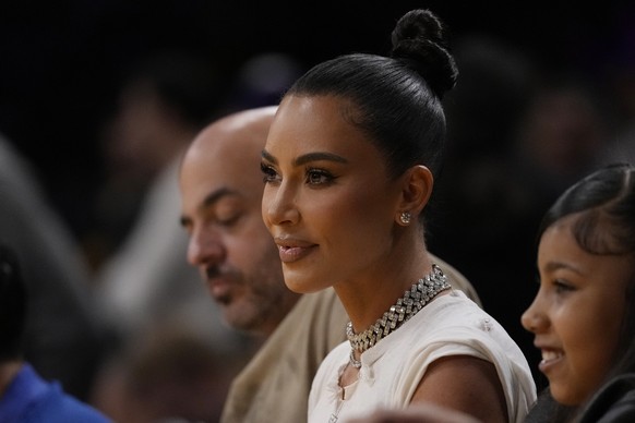 Kim Kardashian watches during the first half in Game 6 of an NBA basketball Western Conference semifinal series between the Los Angeles Lakers and the Golden State Warriors Friday, May 12, 2023, in Lo ...