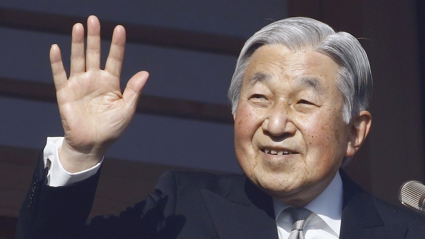 FILE - In this Jan. 2, 2017, file photo, Japan&#039;s Emperor Akihito waves to well-wishers from the palace balcony during a New Year&#039;s public appearance with his family members at the Imperial P ...