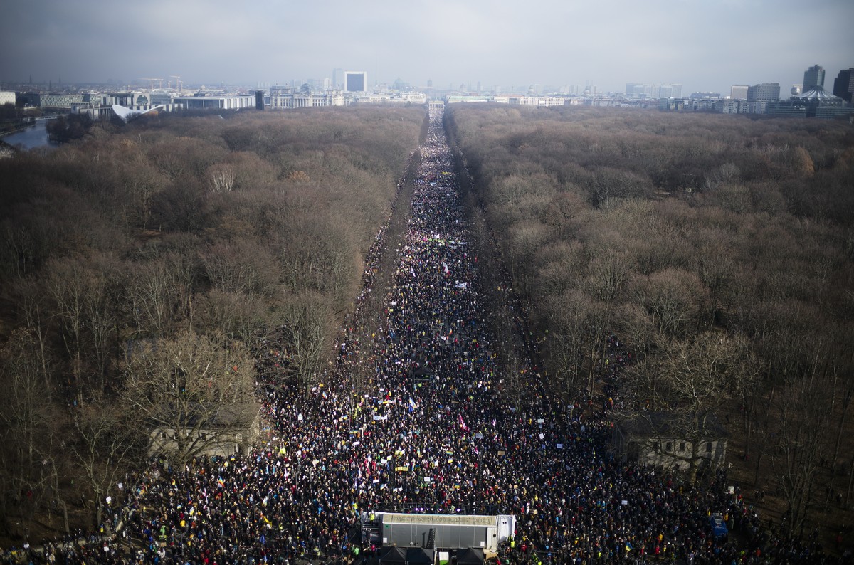Thousands of people attend a rally against Russia's invasion of Ukraine in Berlin, Germany, Sunday, Feb. 27, 2022. (AP Photo/Markus Schreiber)