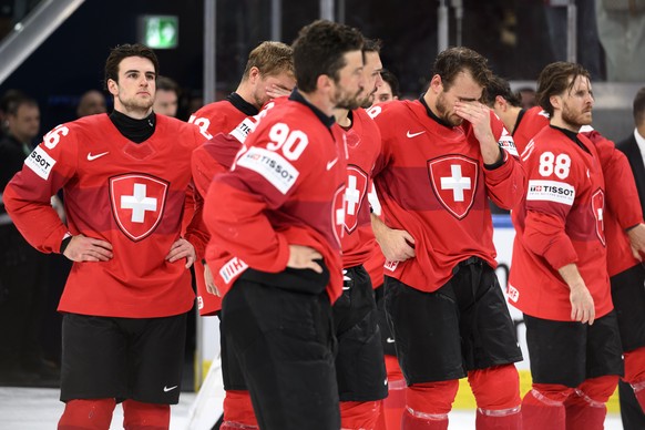 Switzerland's players react with disappointment after the defeat during the 2026 IIHF Men's Ice Hockey World Championship gold medal game between Switzerland and Finland, at the Swiss Life A ...