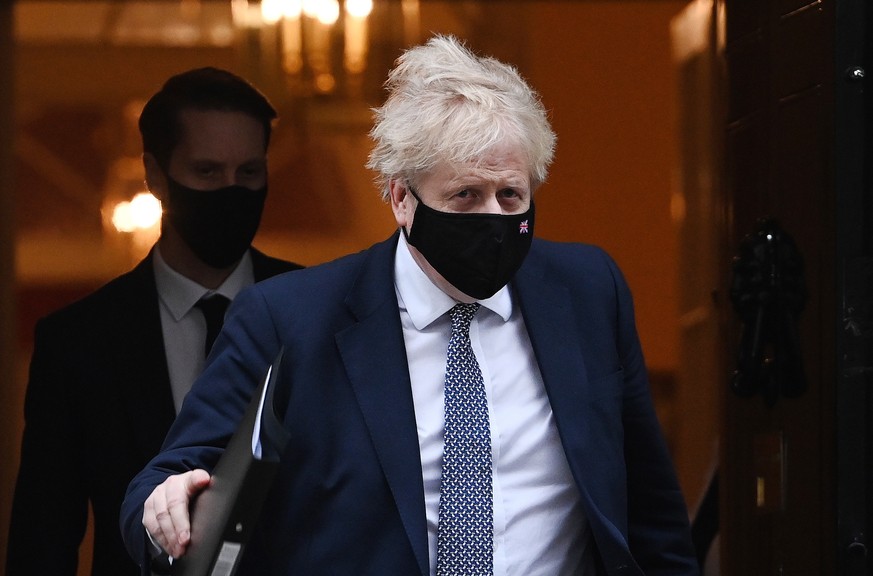 epa09708050 British Prime Minister Boris Johnson departs 10 Downing Street in London, Britain, 25 January 2022. British Prime Minister Boris Johnson is facing increased pressure following further lock ...