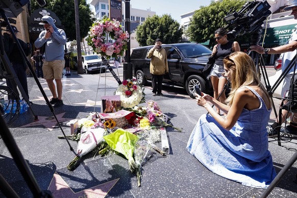 epa13191559 People leave flowers and memorabilia at the Hollywood Walk of Fame star of singer and actress Dolly Parton following her death in Hollywood, California, USA, 25 August 2026. Parton died at ...