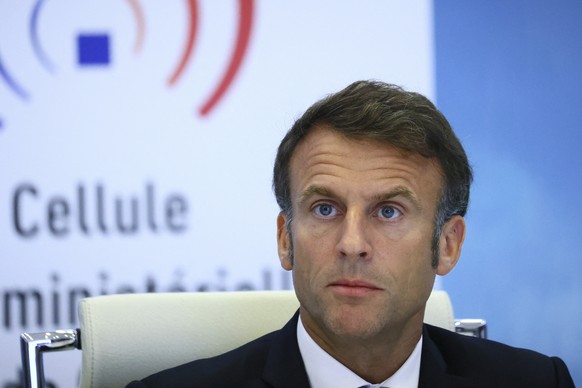 French President Emmanuel Macron attends an emergency meeting of the government after riots broke out across the country for the third night in a row, at the Interior Ministry in Paris, Friday, June 30, 2023. E...