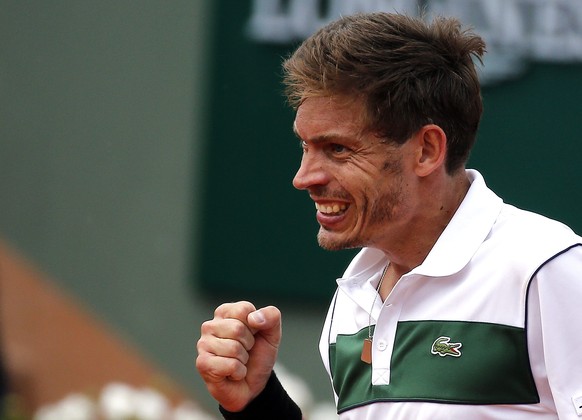 epa04774129 Nicolas Mahut of France reacts as he plays against Gilles Simon of France during their third round match for the French Open tennis tournament at Roland Garros in Paris, France, 29 May 201 ...