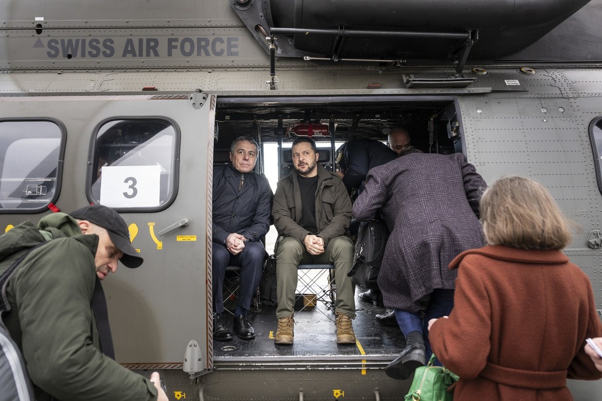 Switzerland's Foreign Minister Federal Councillor Ignazio Cassis, left, and his State guest Volodymyr Zelenskyy, President of Ukraine, right, get ready for takeoff in a Super Puma Helicopter of t ...