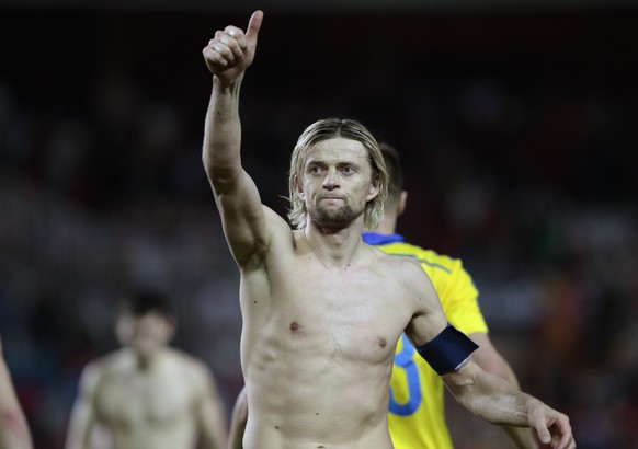 Ukraine&#039;s Anatoliy Tymoshchuk greets supporters at the end of the Euro 2016 qualifying soccer match between Spain and Ukraine, at the Ramon Sanchez Pizjuan stadium, in Seville, Spain, on Friday,  ...