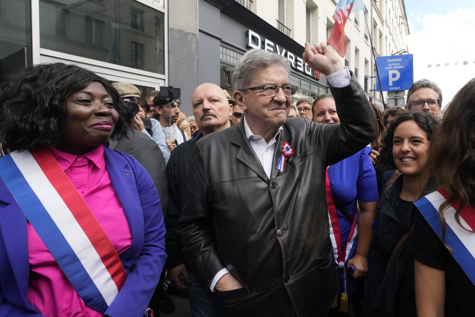France Unbowed leader Jean-Luc Melenchon, center, who criticized as a power grab the president&#039;s appointment of a conservative new prime minister, Michel Barnier, gestures as he participates in a ...