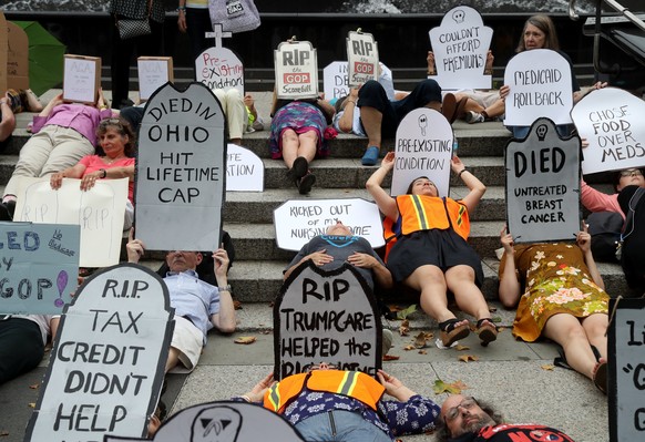 epa06086080 People participate in the Women’s March Alliance Die in For Healthcare at Foley Square in New York, New York, USA, 13 July 2017. The demonstration was organized to garner public attention  ...